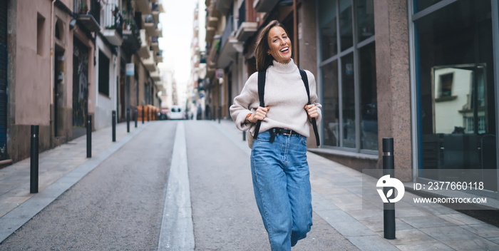 Cheerful woman walking on street