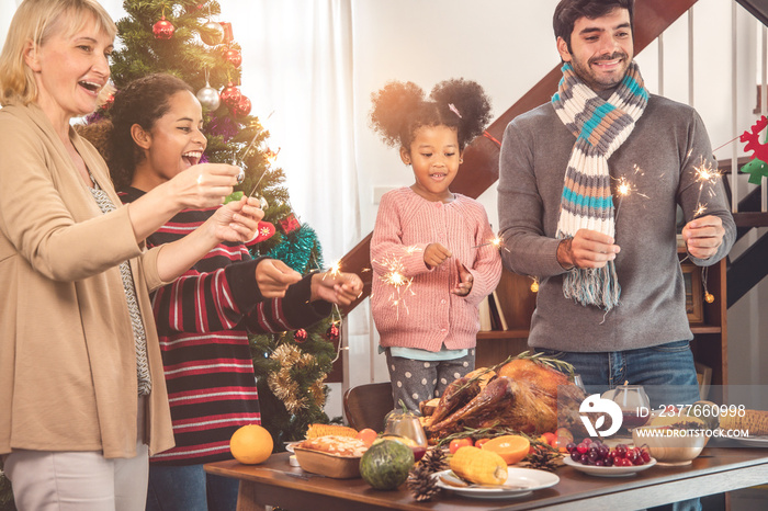 Thanksgiving Celebration Tradition Family Dinner Concept.family having holiday dinner and cutting turkey.Young black adult woman and her daughter happy..