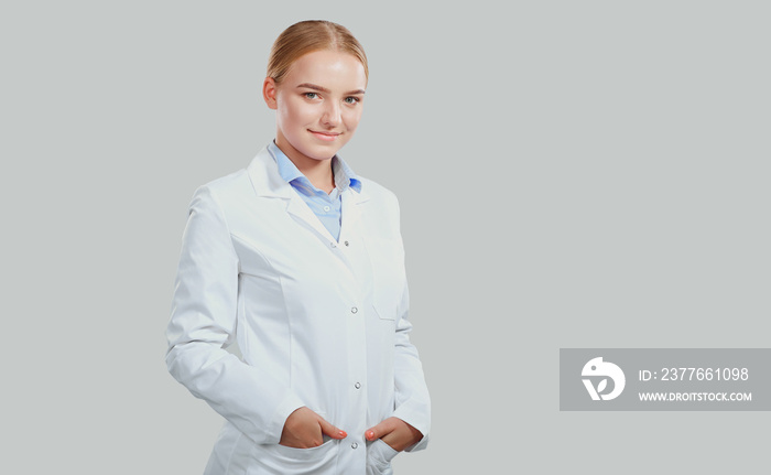 Woman doctor smiling blonde on a background.