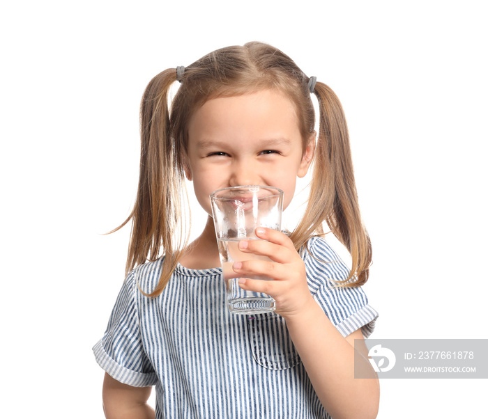 Cute little girl drinking water on white background