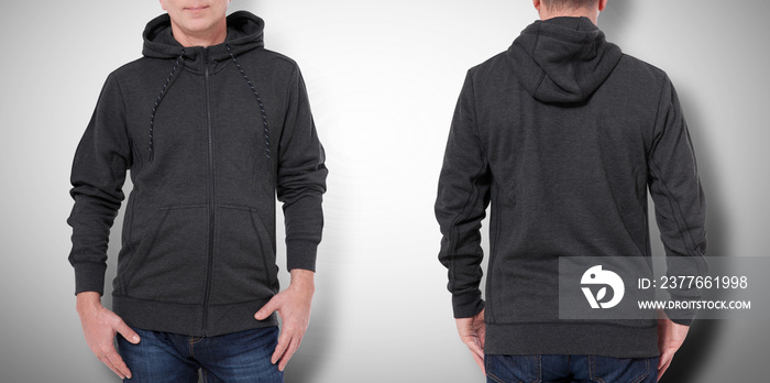 Man in black sweatshirt, black hoodies front and rear. grey background