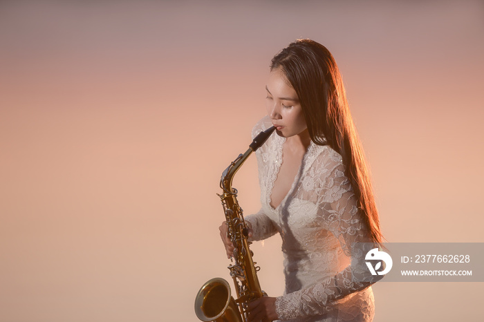 Saxophone, music instrument played by saxophonist player musician  in lake on during sunset