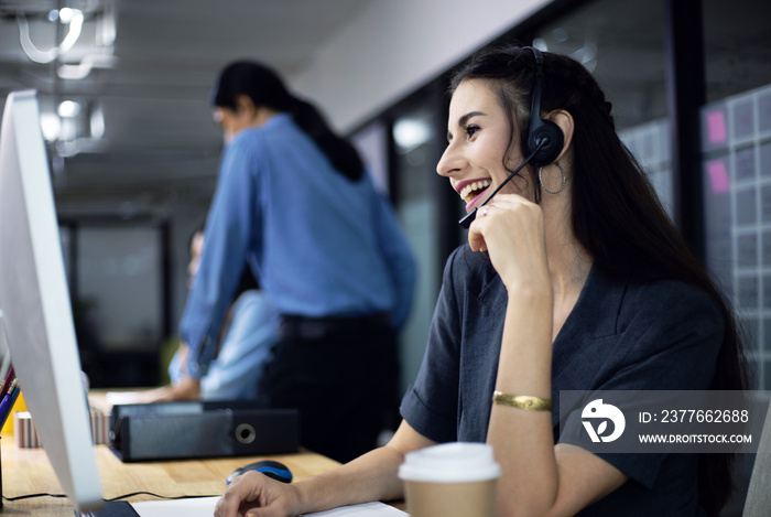 Beautiful reception call center woman speaking and talking with customer on phone line.