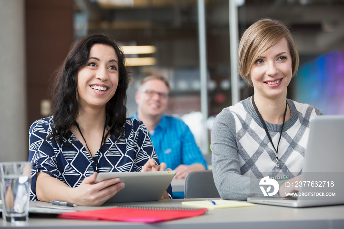 Happy adult woman smiling in classroom.