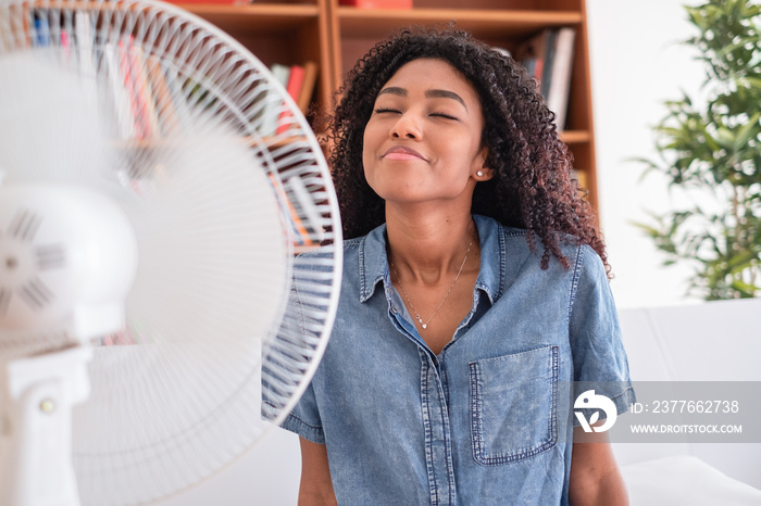 Portrait of black girl cooling against hot weather