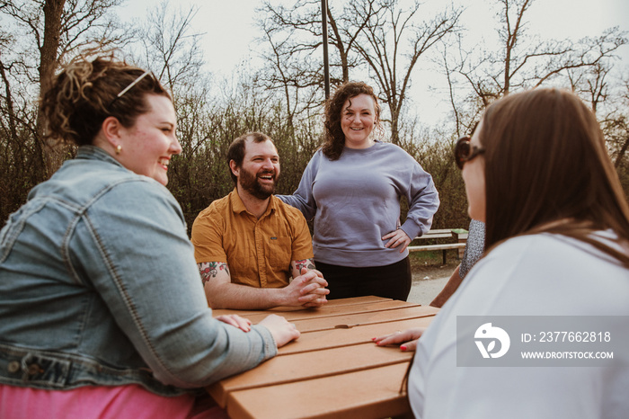 friends talk around a table