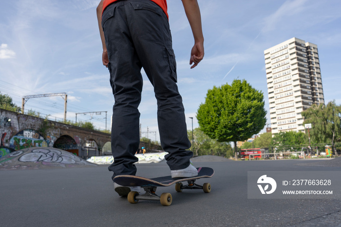 Young man skateboarding in skate park