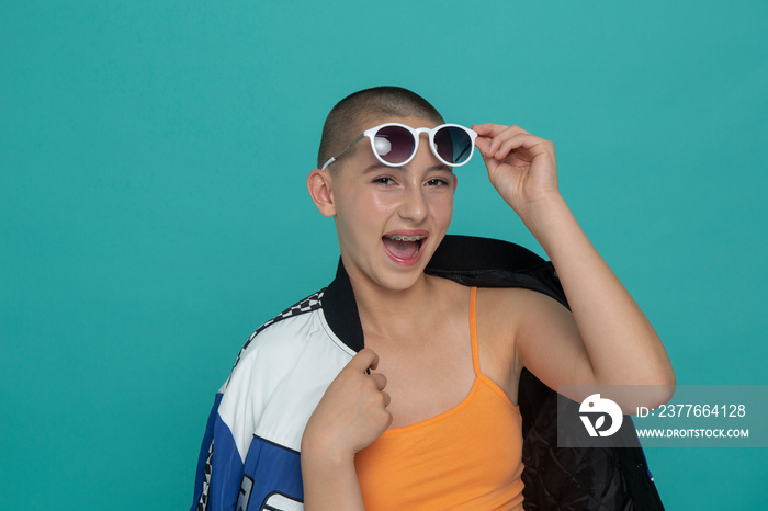 Studio portrait of stylish girl with sunglasses