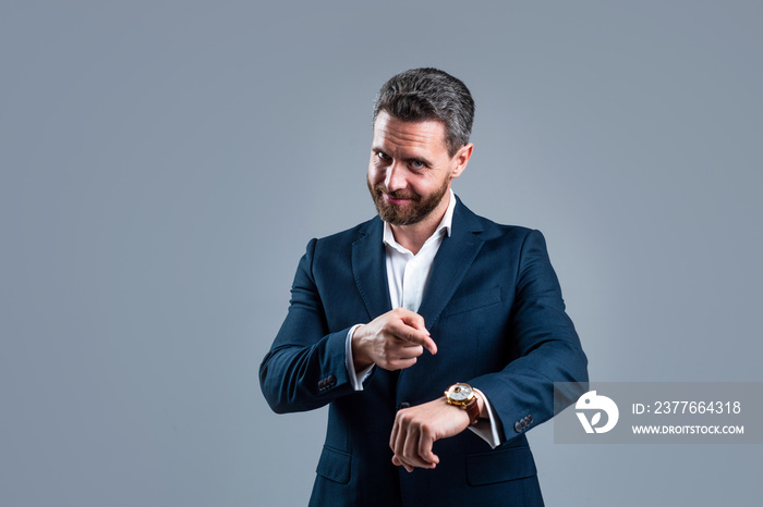 male fashion accessory. man in jacket on grey background. confident businessman with hand watch. need more time. modern life and business success. ceo or boss wear formal clothes