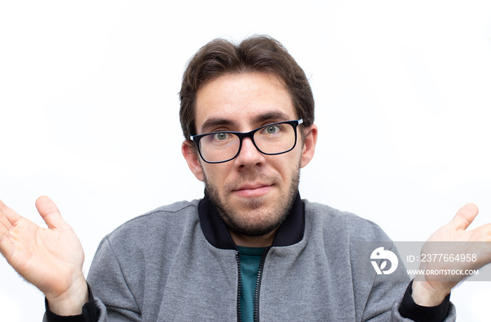 young man guy shrug showing off his new glasses from an optician’s shop isolated on white background