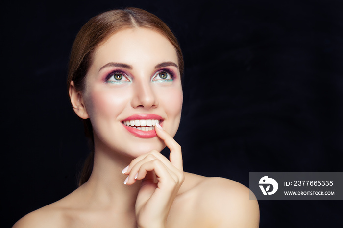 Glamorous woman with makeup looking up