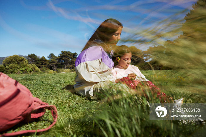 Mother and daughter having a tender moment during family camping trip amongst nature