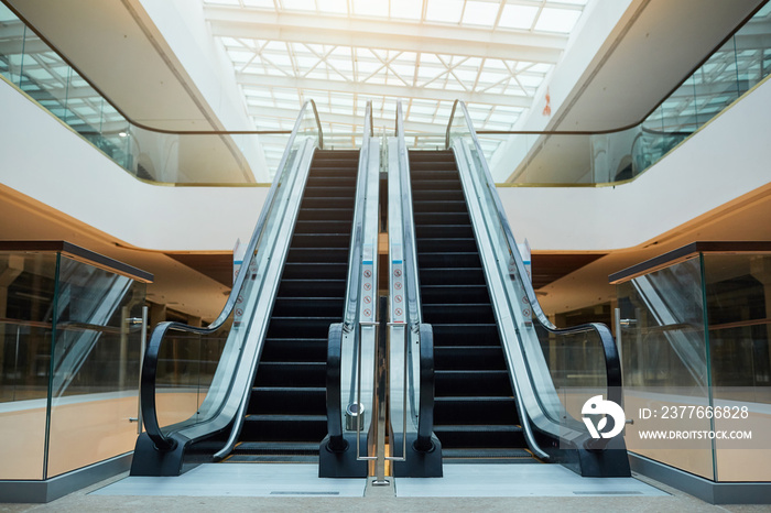 Graphic background image of architectural design with escalator in shopping mall or office building under construction, copy space