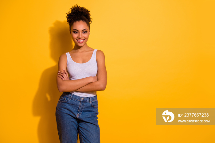 Close up photo cute beautiful amazing she her dark skin lady arms crossed successful professional summer vacation weekend toothy wear casual jeans denim tank-top isolated vivid yellow background