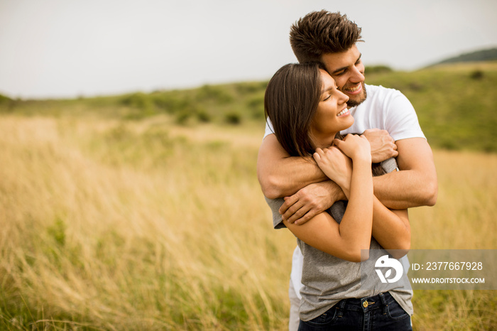 Young couple in love outside in spring nature