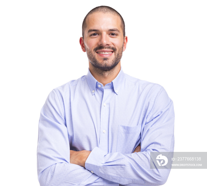 Handsome smiling young man with arms crossed on a white background