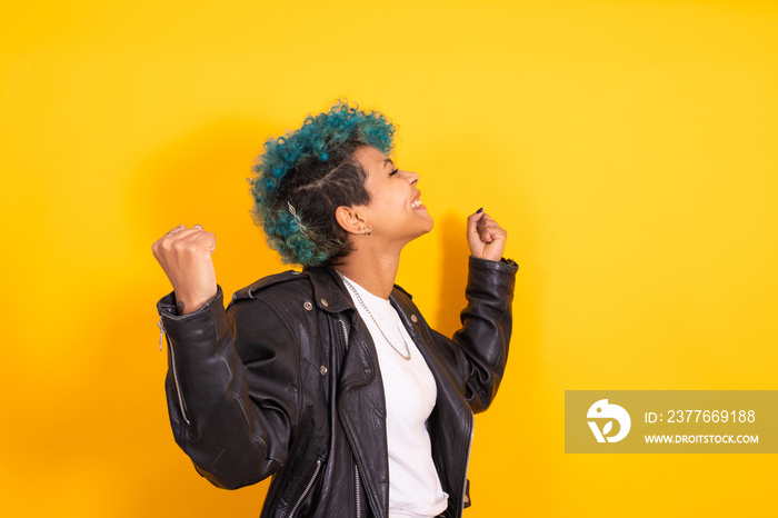 young urban hipster girl isolated on yellow background