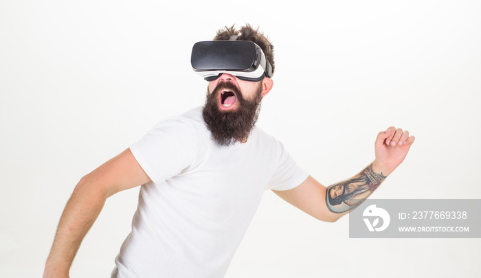 Guy with head mounted display interact virtual reality. Virtual activity. Hipster play virtual sport game. Man bearded gamer VR glasses white background. Virtual reality game concept. Cyber sport