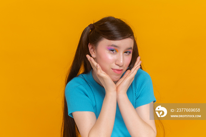 Studio portrait of girl with colorful make-up