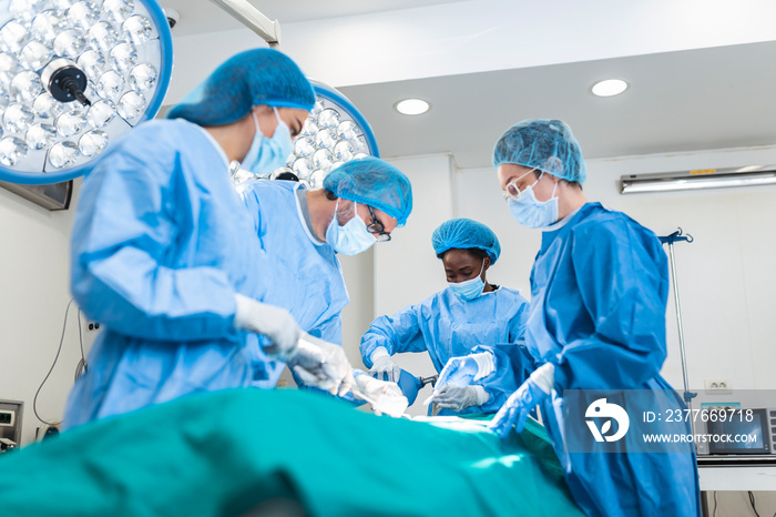 Doctor and assistant nurse operating for help patient from dangerous emergency case .Surgical instruments on the sterile table in the emergency operation room in the hospital.Health care and Medical