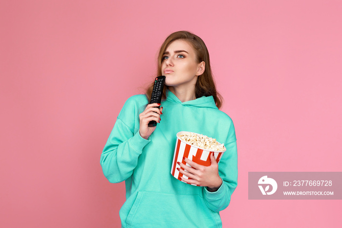 woman in sweatshirt, 3d glasses with remote control