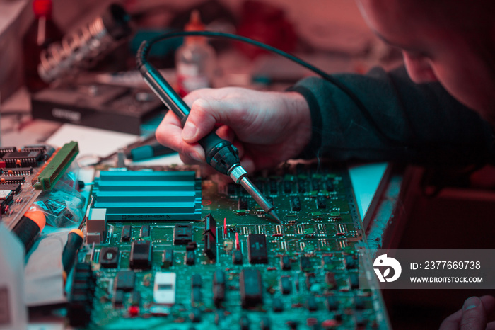 Electronic circuit board. Computer repair. neon blue light