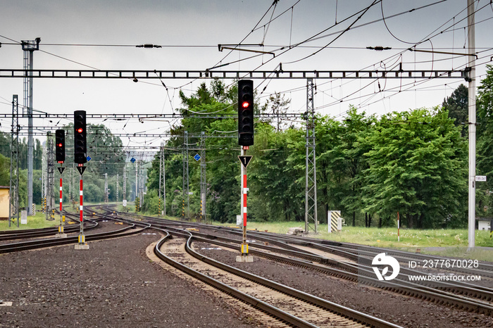 Red semaphores and railway tracks. Traffic lights shows red signal on railway.