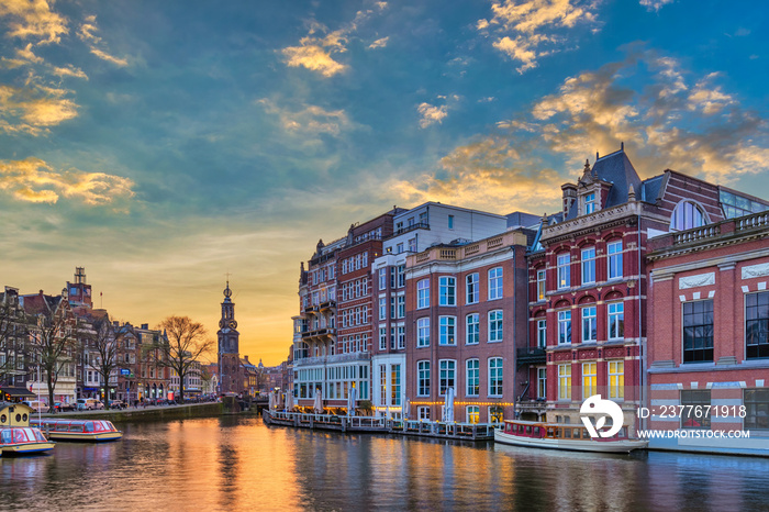 Amsterdam Netherlands, sunset city skyline of Dutch house at canal waterfront