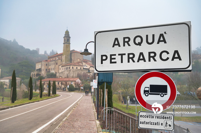 Arqua’ Petrarca, Italy:  city road sign, old town in the background