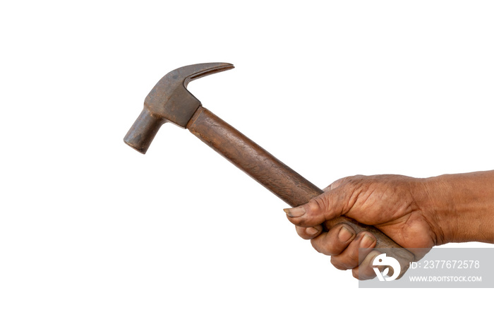 The hand of the mechanic is holding a old hammer