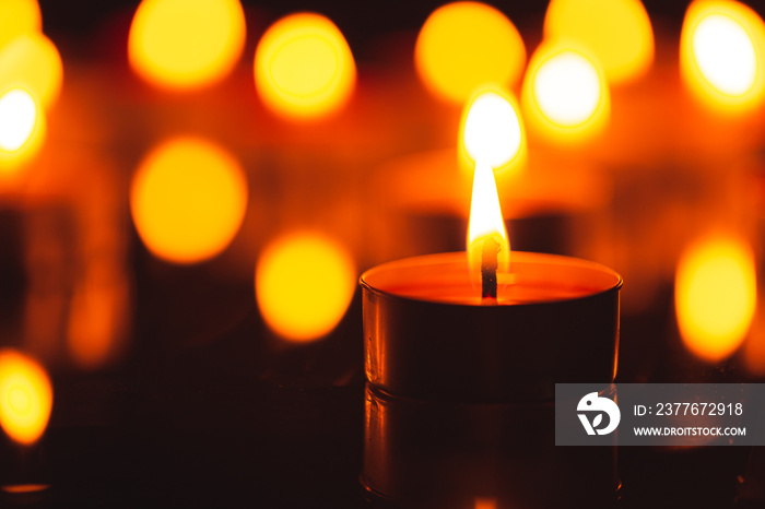 Scented candle,scented candles on old wooden background,Symbol of eternal memory, mourning, minutes of silence, memorial day. The concept of loss and to the memory