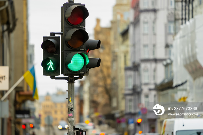 Green traffic light for cars and pedestrians in city