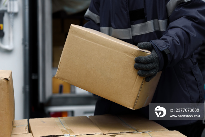 Picking up package boxes in the loading area of cold storage warehouse prepare to transfer storage in the freezing room, Warehouse Storage System Service in Export-Import Logistics Business concept