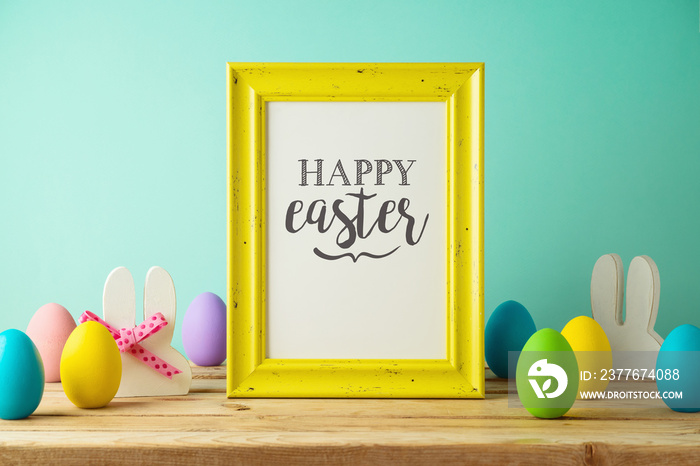 Easter holiday photo frame mock up with Easter eggs  decoration on wooden table