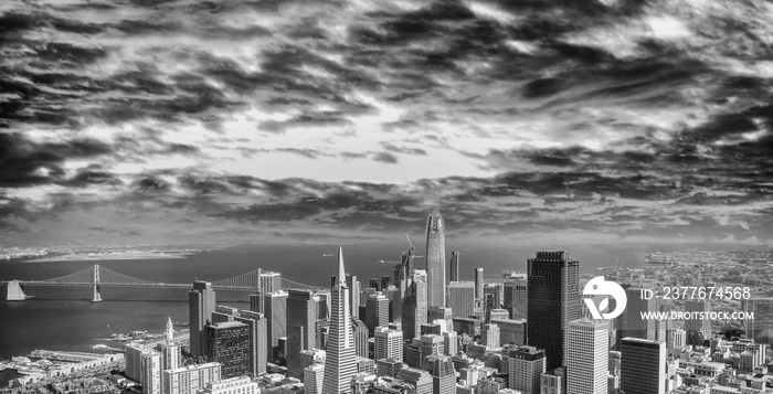 Aerial view of Downtown San Francisco and Bay Bridge from helicopter at dusk