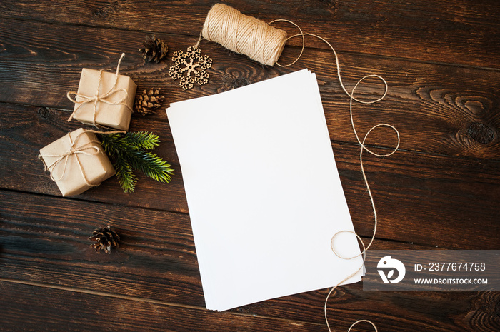 Mockup Christmas gift boxes and blank paper on a background and place for text