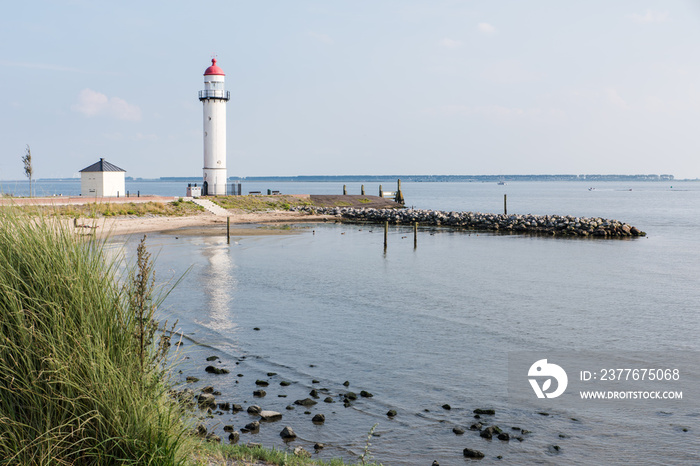 The historical white lighthouse at the Haringvliet in Hellevoetsluis in the Netherlands.