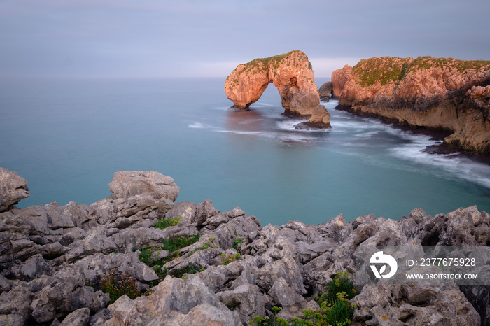 Sunset with beautiful light at Elephant Rocks of Castro de las gaviotas, Northern Spain