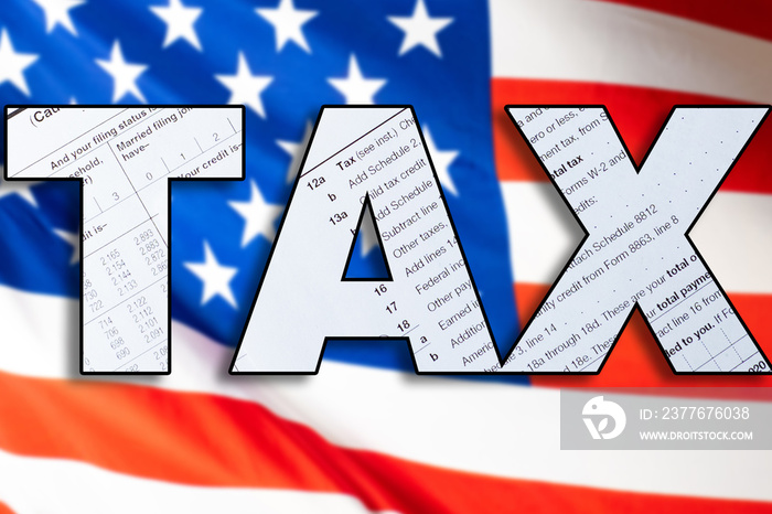 TAX. Paying taxes in the USA. Internal Revenue Service. Concept - IRS USA. Concept - services of a tax attorney in America. Flag of the United States of America. Inscription tax. Taxation