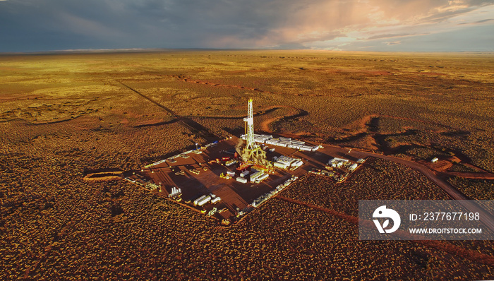 Aerial photo of hydraulic fracturing equipment at sunset. (FRACKING)