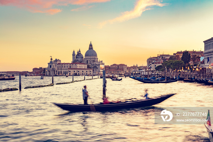 Gondola ride in Venice, Italy at sunset.