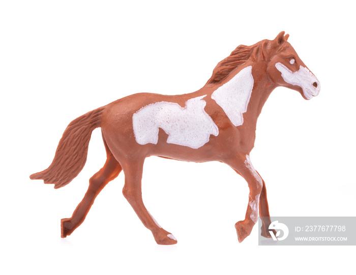 Toy horse made of plastic isolated on white background