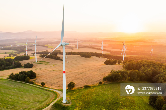 Aerial view of wind turbines and windmills in the field. Alternative green electrical energy generation.