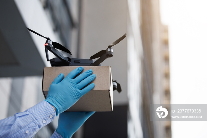 Man using drone for fast delivery of package with products