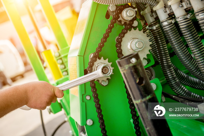 The mechanics repair combine harvester. Modern agricultural machinery