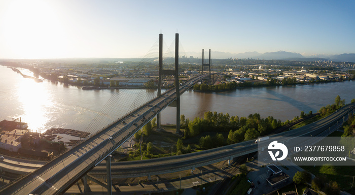 Aerial view of Alex Fraser Bridge during a vibrant sunny day. Taken in North Delta, Greater Vancouver, BC, Canada.