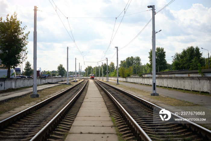 Tram public transport moving on railroad line to the platform