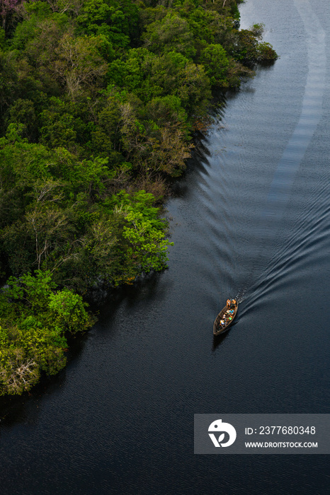 Aerial view of a small boat over the river