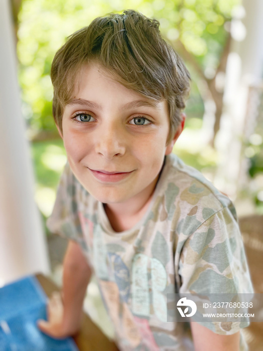 Portrait of preteen school kid boy. Beautiful happy child looking at the camera. Schoolboy smiling. Education concept.