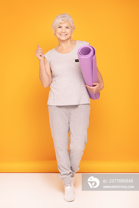 Happy senior woman exercising.